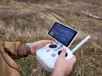 Person holding a landscape documentation device
